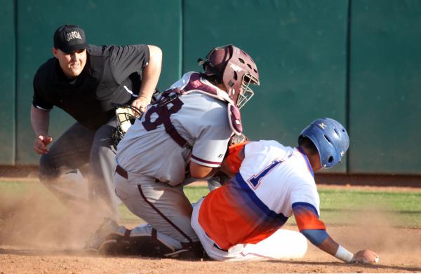 Bishop Gorman’s Kai Domingo is tagged out by Cimarron-Memorial catcher Ricky Dorantes ...
