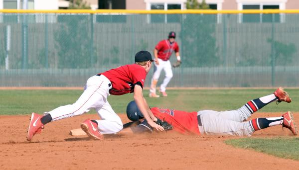 Coronado’s Julian Burrola steals second base under the tag of Liberty’s James Ma ...