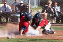 Coronado’s Carmen DiGennaro slides in under the tag of Liberty catcher Joe Maurer to s ...