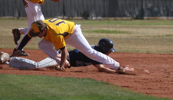 Centennial’s Cooper Powell dives back to second base as Bonanza’s Sean DeSoto lo ...