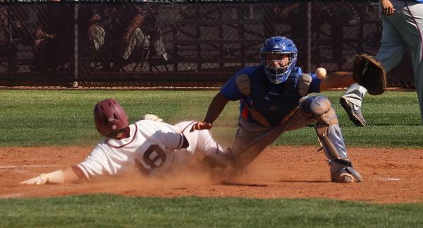 Cimarron-Memorial’s Ricky Dorantes slides safely past Bishop Gorman catcher Michael Bl ...