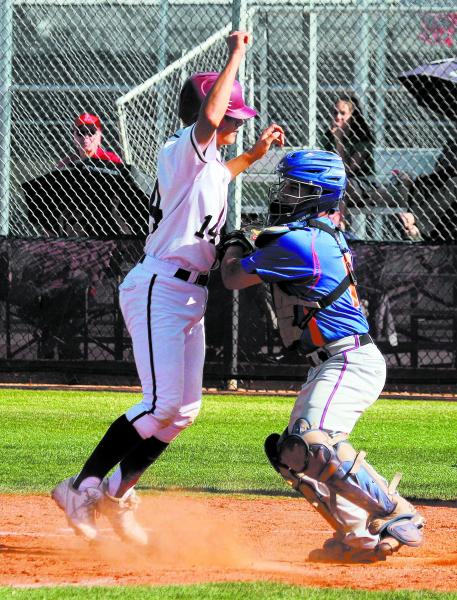 Bishop Gorman’s Michael Blasko, right, tags out Cimarron-Memorial’s Nico Decolat ...