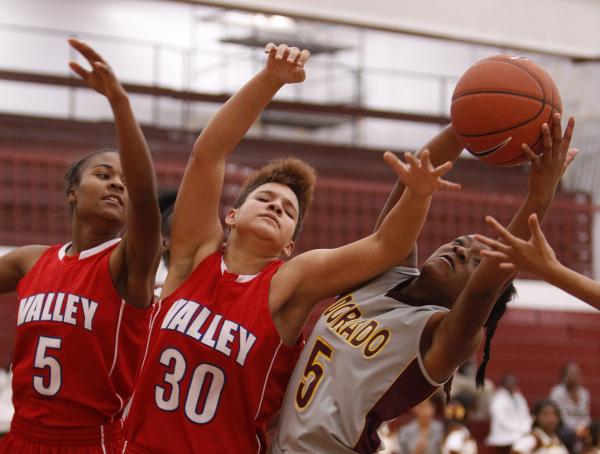 Eldorado’s Paige Thomas (5) battles for a rebound against Valley’s Angie Sanchez ...