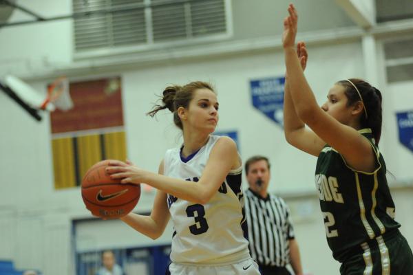 Durango basketball player Holly Dierschke (3), left, prepares to pass the ball against Maris ...