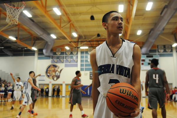 Virgin Valley’s Garrett Leavitt (20) beats Chaparral’s Tyree McNeal (35) to the ...