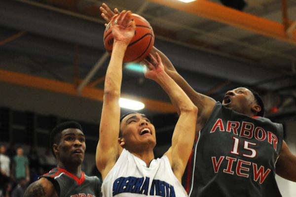 Virgin Valley’s Cody Burnside (34) pump fakes a shot against Chaparral’s Marc Si ...