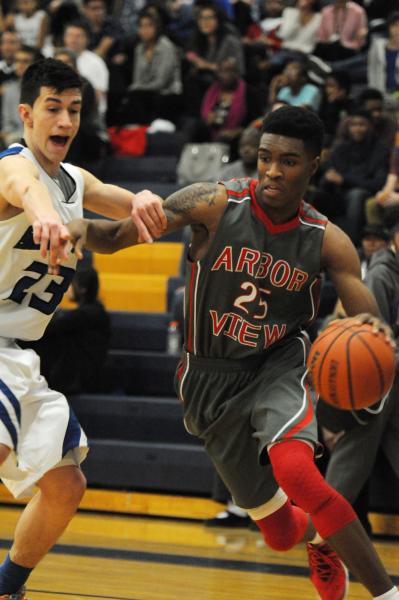 Chaparral’s Richard Nelson (23), right, is blocked by Virgin Valley’s Dee Bowler ...