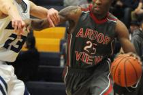 Chaparral’s Richard Nelson (23), right, is blocked by Virgin Valley’s Dee Bowler ...