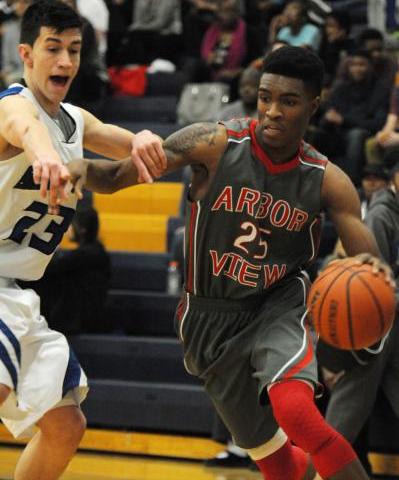 Chaparral’s Richard Nelson (23), right, is blocked by Virgin Valley’s Dee Bowler ...