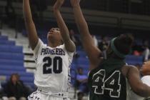 Canyon Springs’ Alexia Thrower (20) goes in for a layup past Rancho’s LaKissa Ma ...