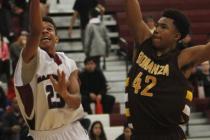 Desert Oasis’ Rodrick Moore (23) shoots past Bonanza’s Davian Jordan (42) on Fri ...