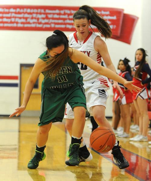 Green Valley’s Gracelle Garcia (11) is blinded by her hair as Liberty’s Kealy Br ...