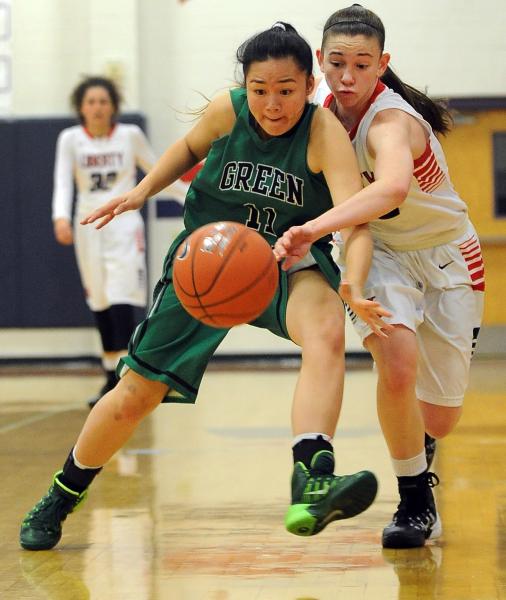 Green Valley’s Gracelle Garcia (11) and  Liberty’s Kealy Brown battle for a ...