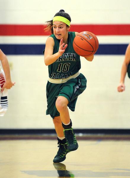 Green Valley’s Maggie Manwarren brings the ball down court against Liberty on Monday.