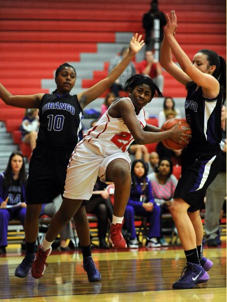 Arbor View’s Jocelyn Jordan (21) drives to the basket between Durango’s Taylor G ...