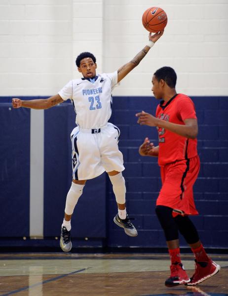 Canyon Springs’s Shaquile Carr grabs as Las Vegas’s Patrick Savoy defends on Wed ...