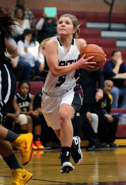 Faith Lutheran’s Dani Tharaldson drives to the basket against Clark on Thursday night.