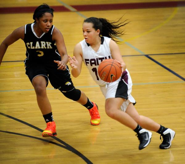 Faith Lutheran’s Kim Munro brings the ball up court against Clark’s Monique Dani ...