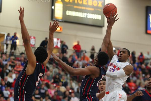 Chaparral’s Tyree McNeal (35), center, takes a shot over Virgin Valley’s defende ...