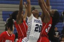 Canyon Springs’ Alexia Thrower (20) has her shot contested by Valley’s Eimainei ...