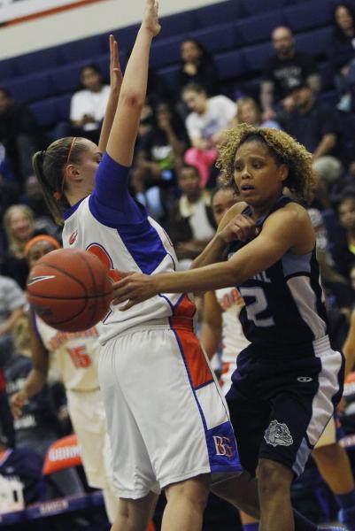 Centennial’s Teirra Hicks (22) passes around Bishop Gorman’s Megan Jacobs (23) o ...