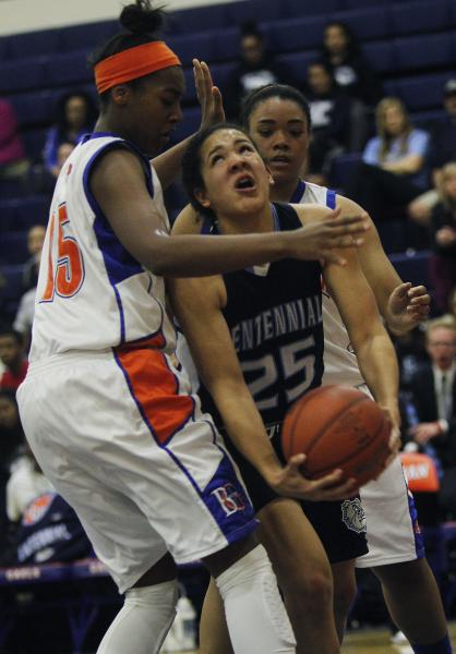 Centennial’s Karina Brandon (25) tries to drive past  Bishop Gorman’s Raych ...