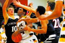 Clark’s Diontae Jones (24) looks to shoot as Coronado’s Travis Boman (10), Nick ...