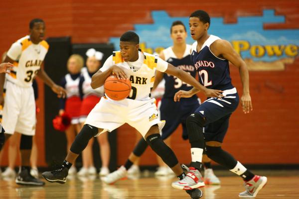 Clark’s Colby Jackson (0) drives past Coronado’s Eddie Austin (22) on Monday. Ja ...