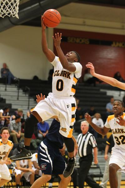 Clark’s Colby Jackson (0) drives for a layup on Monday. Jackson was 2-for-2 from the f ...