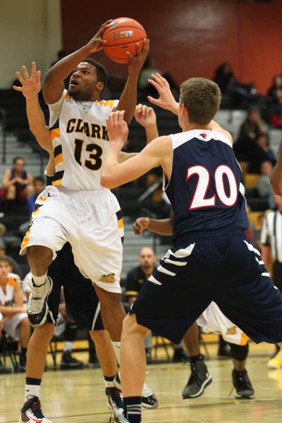 Clark’s Ty’Rek Wells (13) looks to shoot over Coronado’s Nick Korniek (20) ...