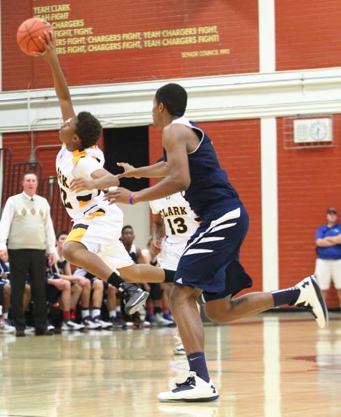 Clark’s Keyshaun Webb (22) gains control of the ball as Coronado’s Nick Howard c ...