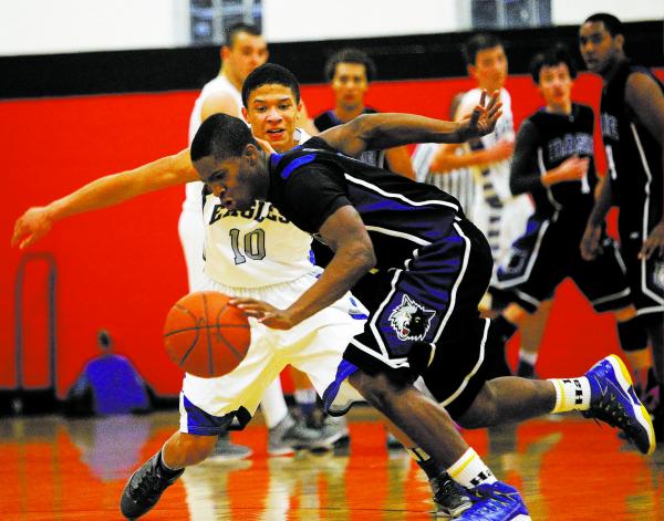 Basic’s Antraye Johnson (2) steals the ball from Graves County’s Andrew Smith (1 ...