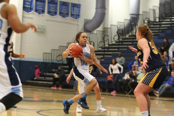 Centennial’s Tramina Jordan (10) drives against El Segundo’s Quinn Adams (55) on ...