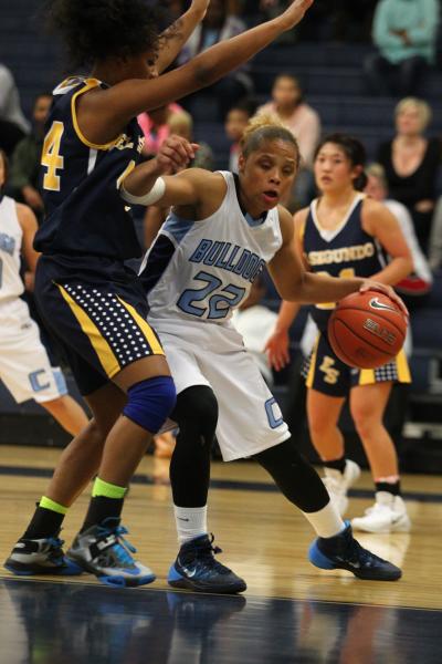 Centennial’s Teirra Hicks (22) looks to get past El Segundo’s Myia Mosley (44) o ...