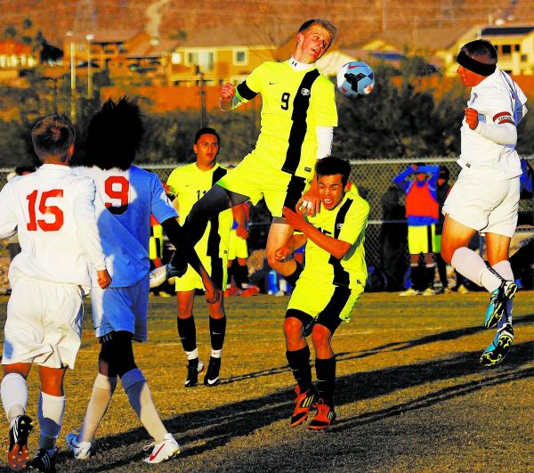 Green Valley’s Kade Kochevar (9) attempts a header against Liberty on Tuesday in the S ...