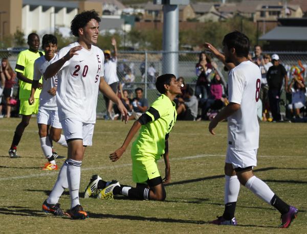 Eldorado’s Andres Lua (20) and Chris Perez (8) congratulate each other after conspirin ...