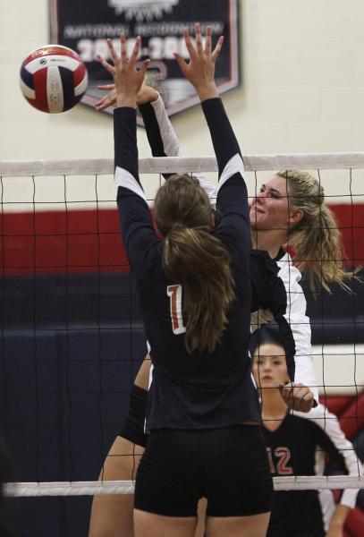 Coronado’s Berkeley Oblad (10) spikes the ball past Legacy’s Ashley Smoot (1) on ...