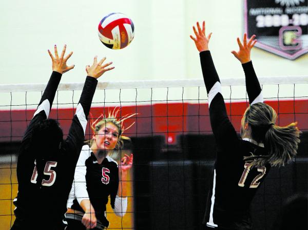 Coronado’s Taylor Jackson (5) spikes the ball past Legacy’s Saipeti Fuiava (15) ...