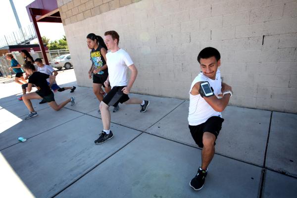 Eldorado cross country runner Eddie Esquivel, right, warms up before a recent practice.