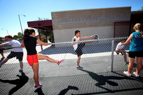 Eldorado cross country runner Eddie Esquivel, center, warms up before a recent practice.