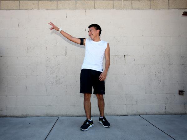 Eldorado cross country runner Eddie Esquivel waves to teammates during a recent practice.