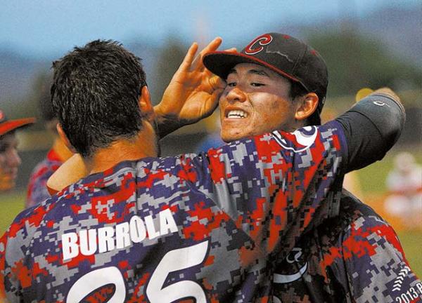 Coronado’s Julian Burrola, left, hugs Chandler Blanchard after the Cougars beat Bishop ...