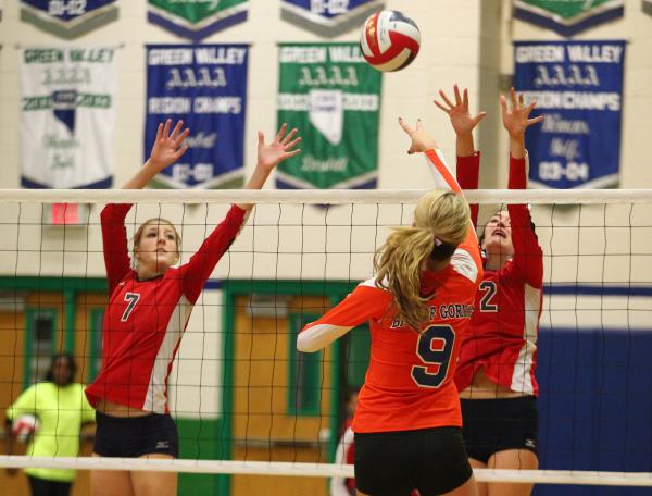 Bishop Gorman’s Emma Kirst (9) attacks as Coronado’s Nikki Jackson (7) and Kelli ...