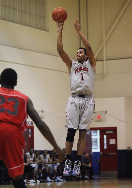 Findlay Prep’s Rashad Vaughn (1) shoots a 3-point shot in front of Planet Athlete&#821 ...