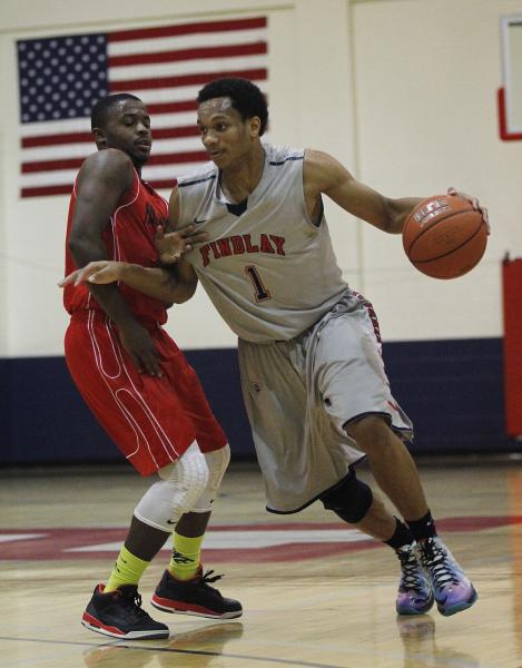 Findlay Prep’s Rashad Vaughn (1) drives past Planet Athlete’s Reginald Norris (1 ...