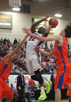 Findlay Prep’s Fallou Ndoye attempts a shot over Bishop Gorman during the BCS Challeng ...