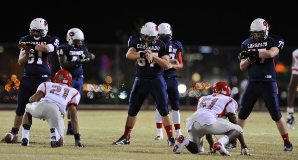 Coronado offensive lineman Tyler Flynn (51), Dylan Alterwitz (67) and Jake Kaufman (77) read ...