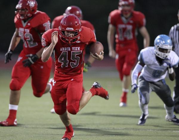 Arbor View running back Ricky Clark goes for 73 yards on the first play from scrimmage again ...