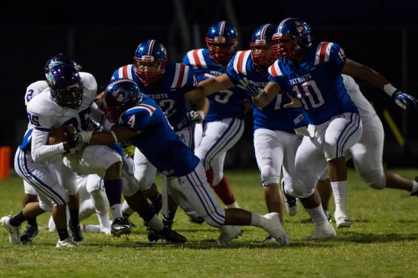 Liberty linebacker Ethan Tuilagi takes down Silverado’s Braden Weaver (35) during Libe ...