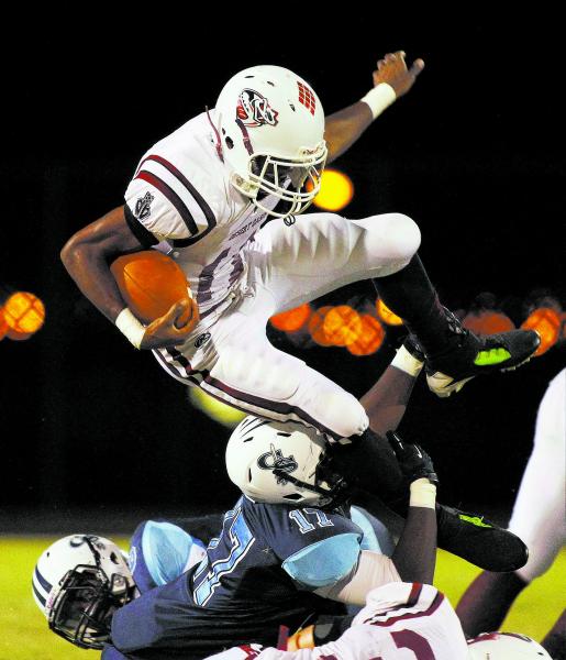 Canyon Springs’ Joe Jackson (17) tackles Desert Oasis’ Jocquez Kalili (11) on Fr ...